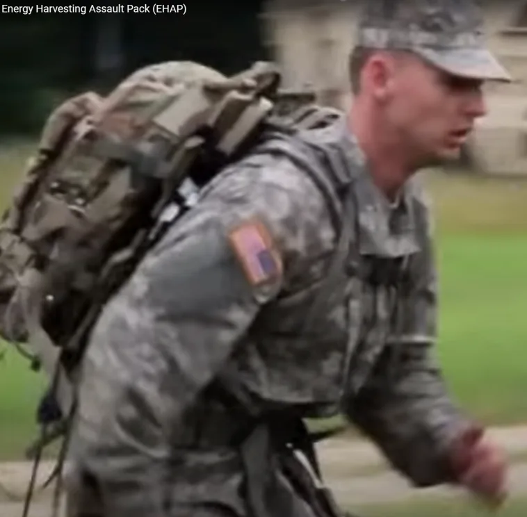 A soldier in ACU running with an Energy Harvesting Assault Pack at Aberdeen Proving Grounds.
